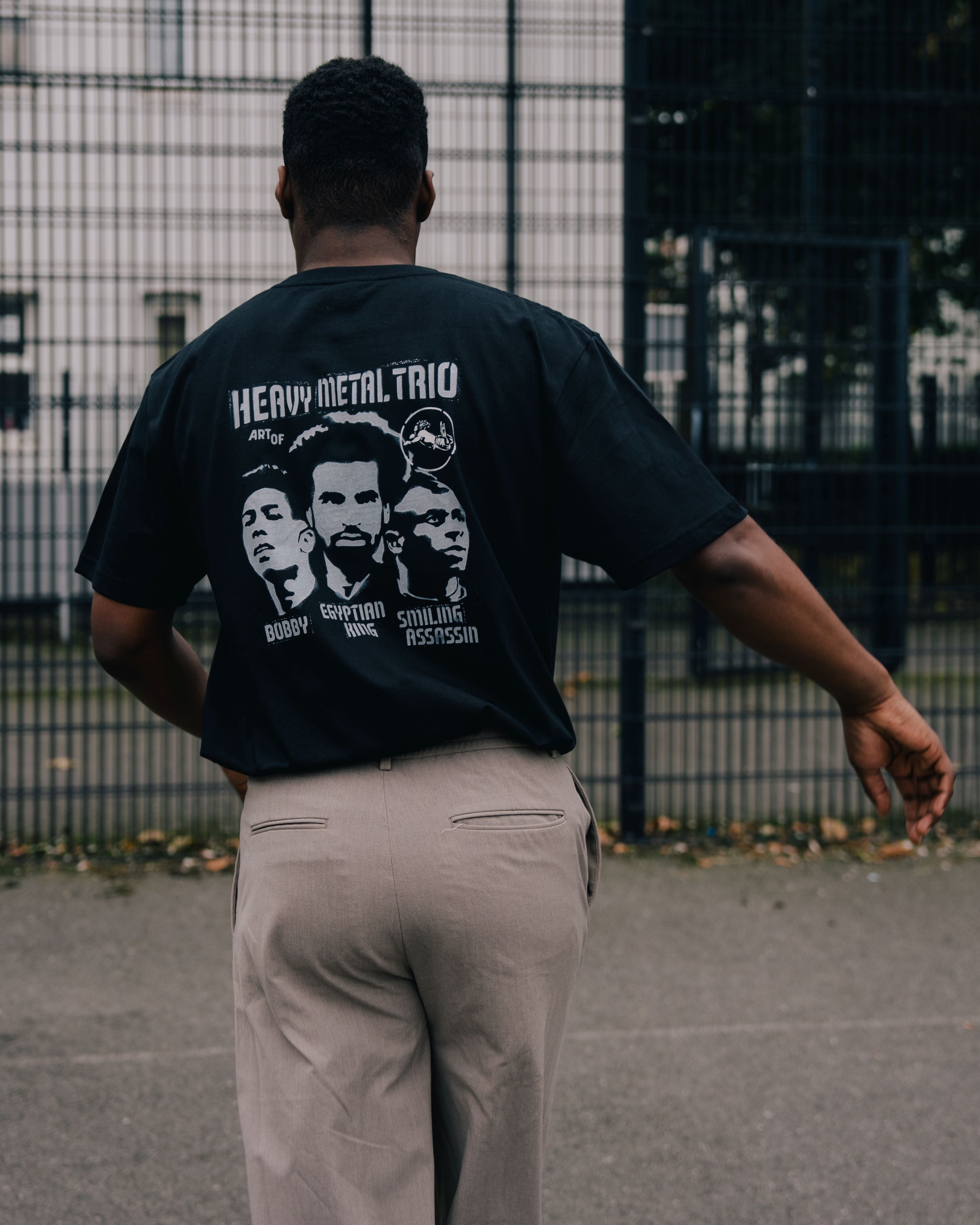 ART OF Secret Tournament Heavy Metal Trio Tee | Black Football T-shirt